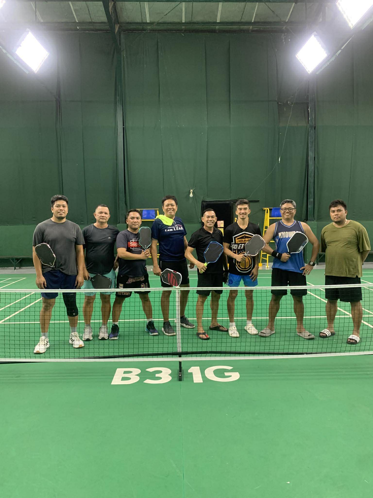 Players lined up at the net before a match